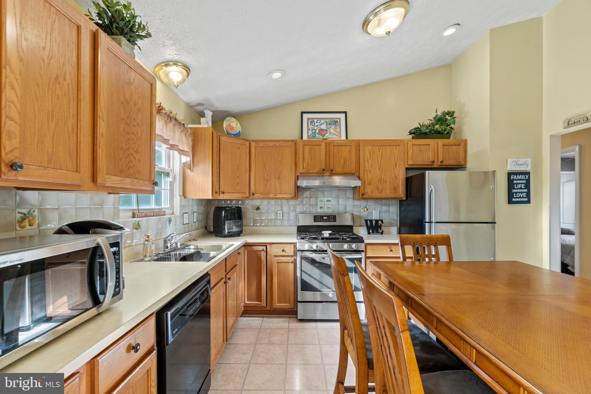 6435 Forest Road Cheverly, MD 20785 - Photo 10 of 46 Kitchen with stainless steel fridge and stove