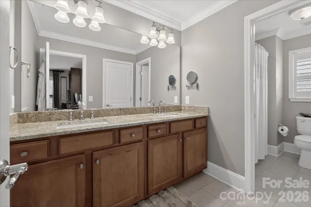 a white toilet sitting next to a bath tub shower