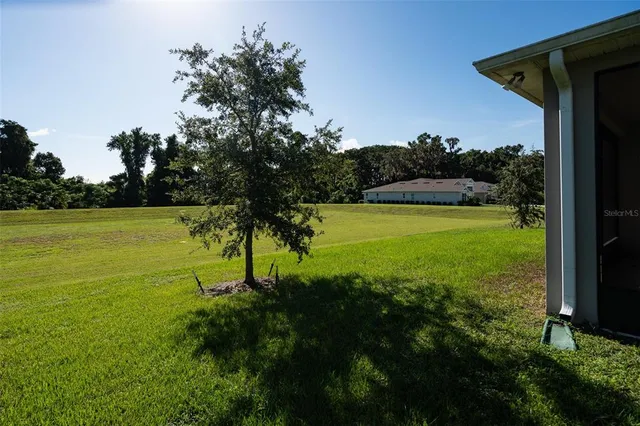 a view of a lake with a big yard