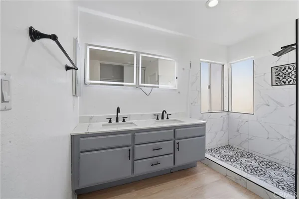 a bathroom with a sink and a shower