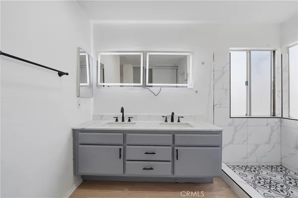 a bathroom with a sink and a mirror