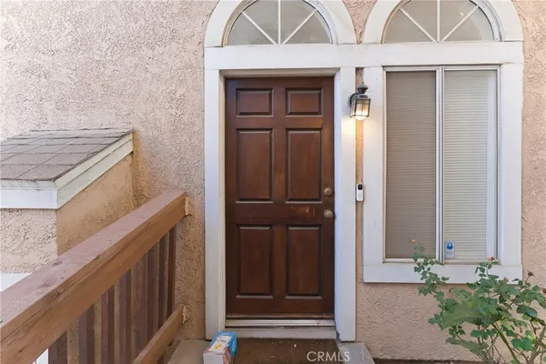 a living room with furniture fireplace and flat screen tv