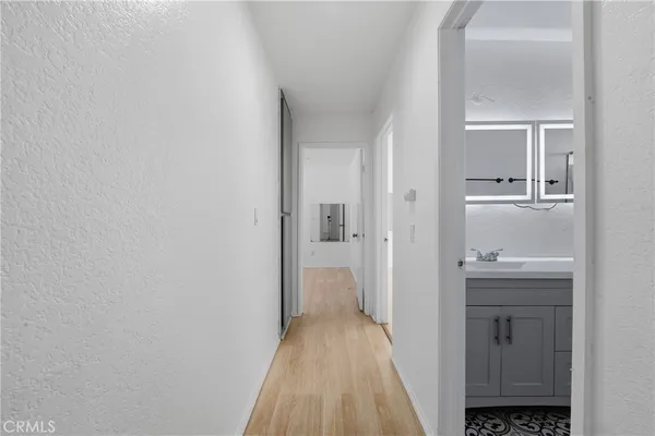 a view of a balcony with wooden floor