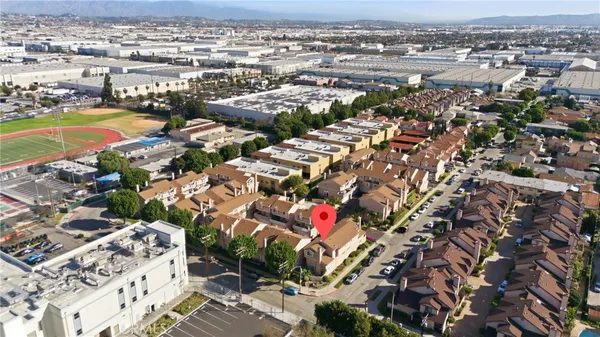 an aerial view of houses with outdoor space