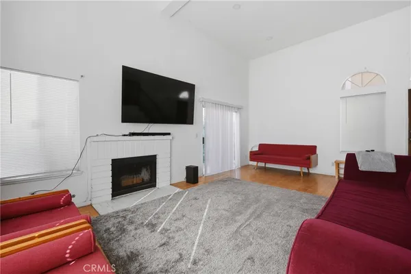 a bedroom with furniture and a rug