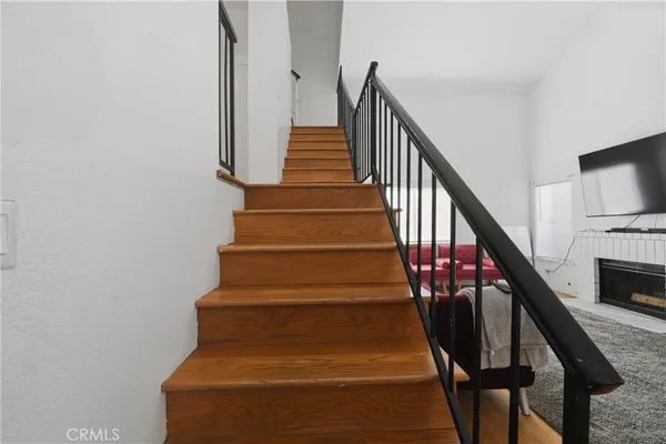 a room with a sink wooden floor and furniture