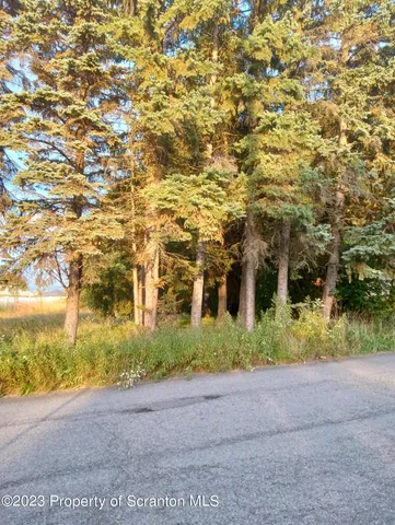 a view of a building with a yard