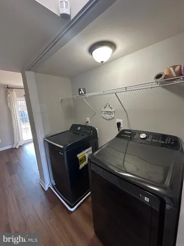 a view of room with window and hardwood floor