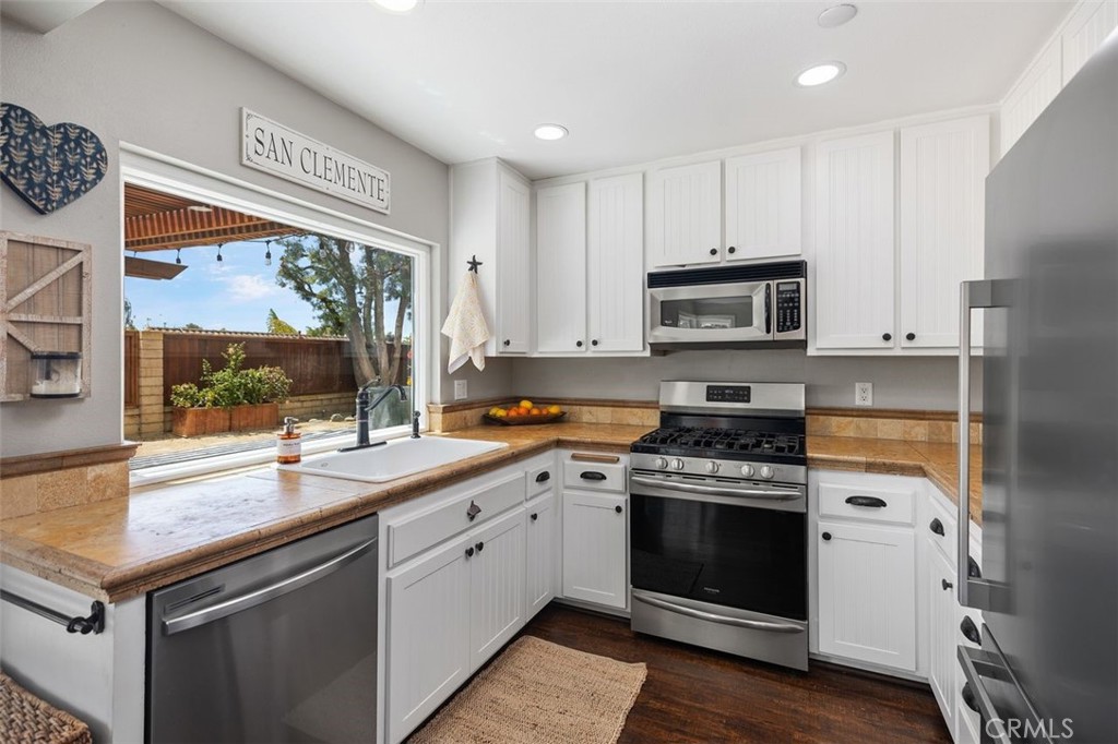 2818 Via Blanco San Clemente, CA 92673 - Photo 15 of 45 a kitchen with a stove a sink and a refrigerator