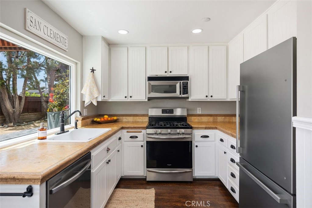 2818 Via Blanco San Clemente, CA 92673 - Photo 16 of 45 a kitchen with a sink stove and refrigerator