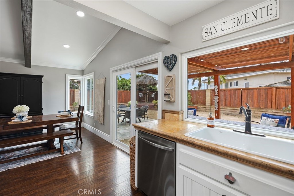 2818 Via Blanco San Clemente, CA 92673 - Photo 19 of 45 a kitchen with stainless steel appliances kitchen island granite countertop a sink and wooden cabinets