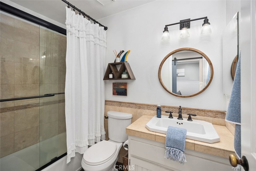 2818 Via Blanco San Clemente, CA 92673 - Photo 22 of 45 a bathroom with a sink toilet and a mirror