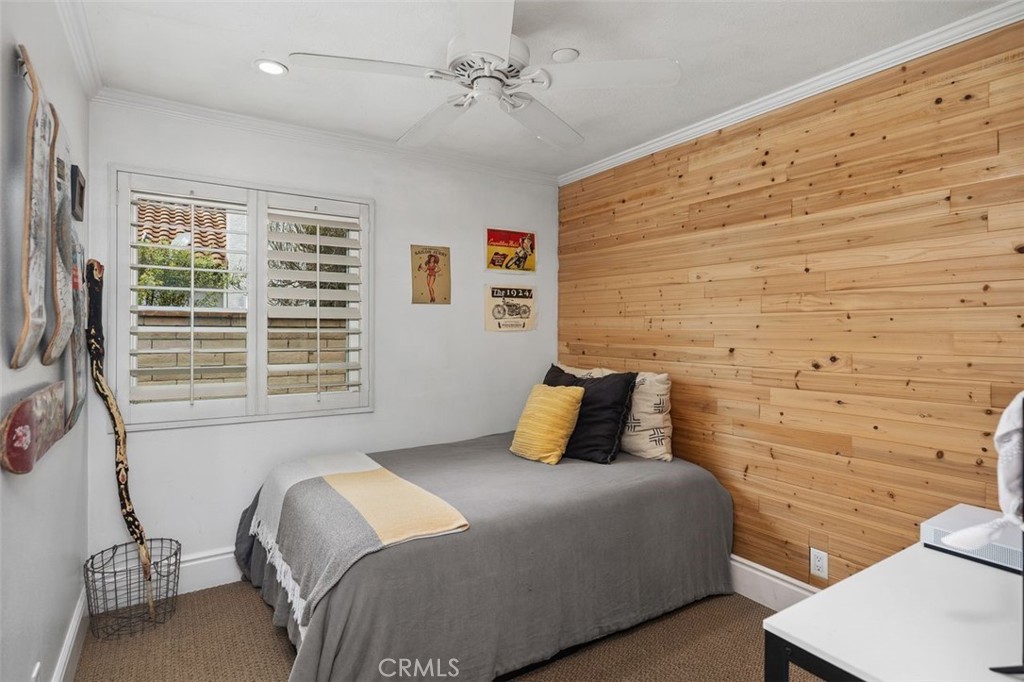 2818 Via Blanco San Clemente, CA 92673 - Photo 24 of 45 a bedroom with a bed and wooden floor