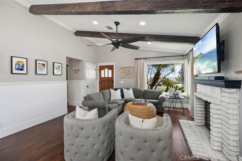 2818 Via Blanco San Clemente, CA 92673 - Photo 7 of 45 a living room with furniture a fireplace and a chandelier