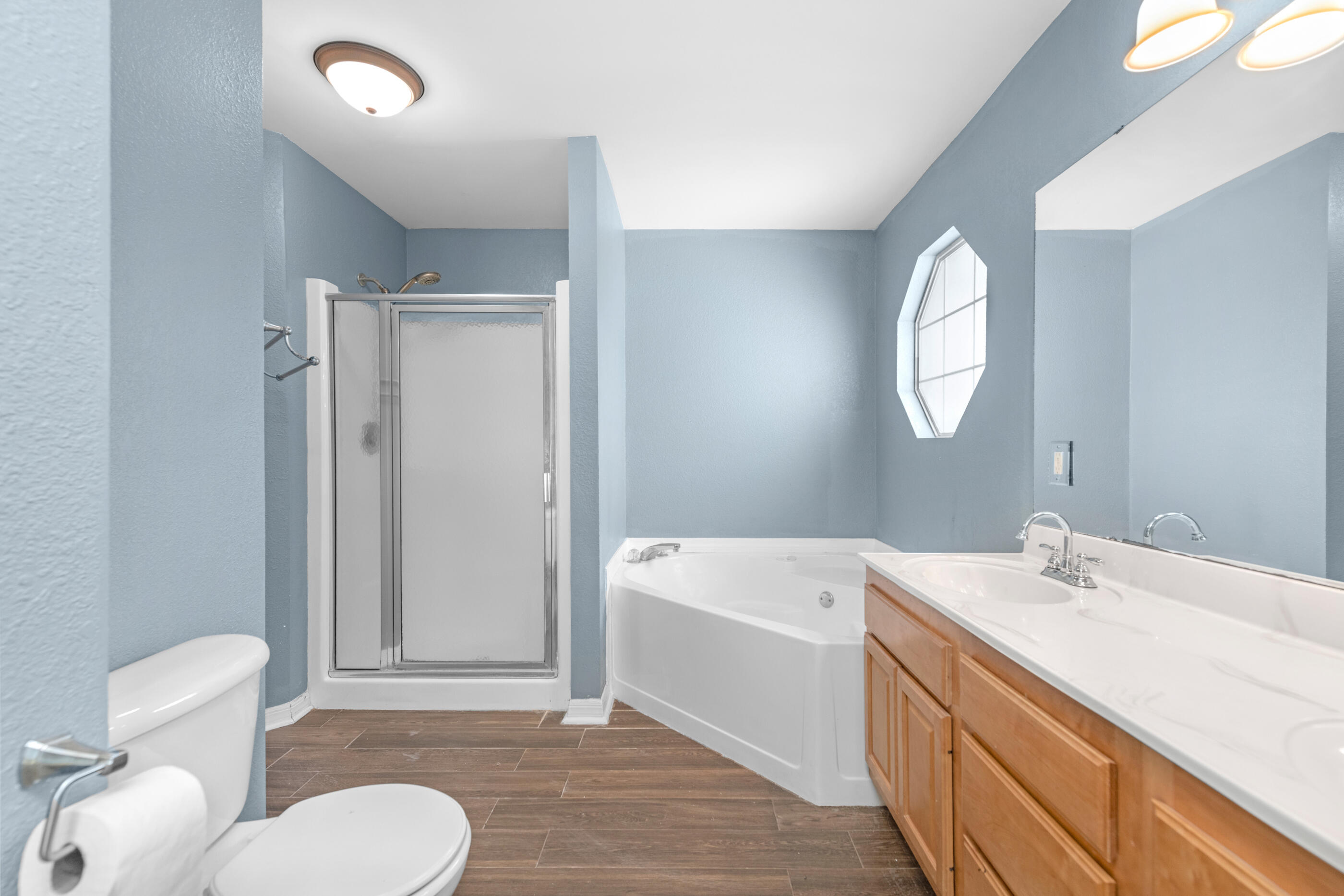 6664 Bellingham Street Navarre, FL 32566 - Photo 14 of 28 a bathroom with a sink toilet and shower