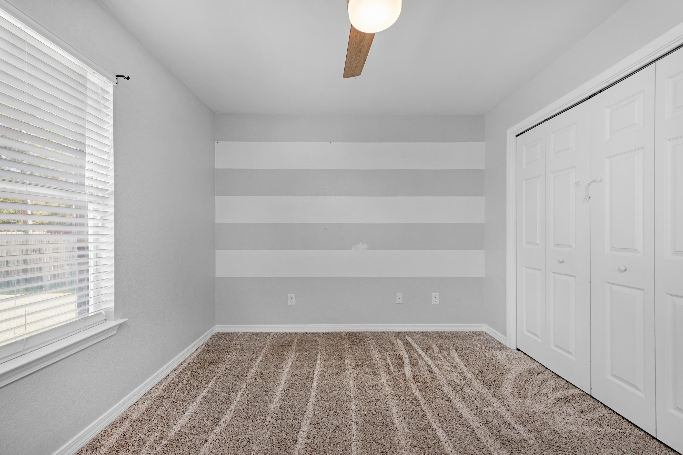 6664 Bellingham Street Navarre, FL 32566 - Photo 15 of 28 a view of a room with rack on the wall and a window