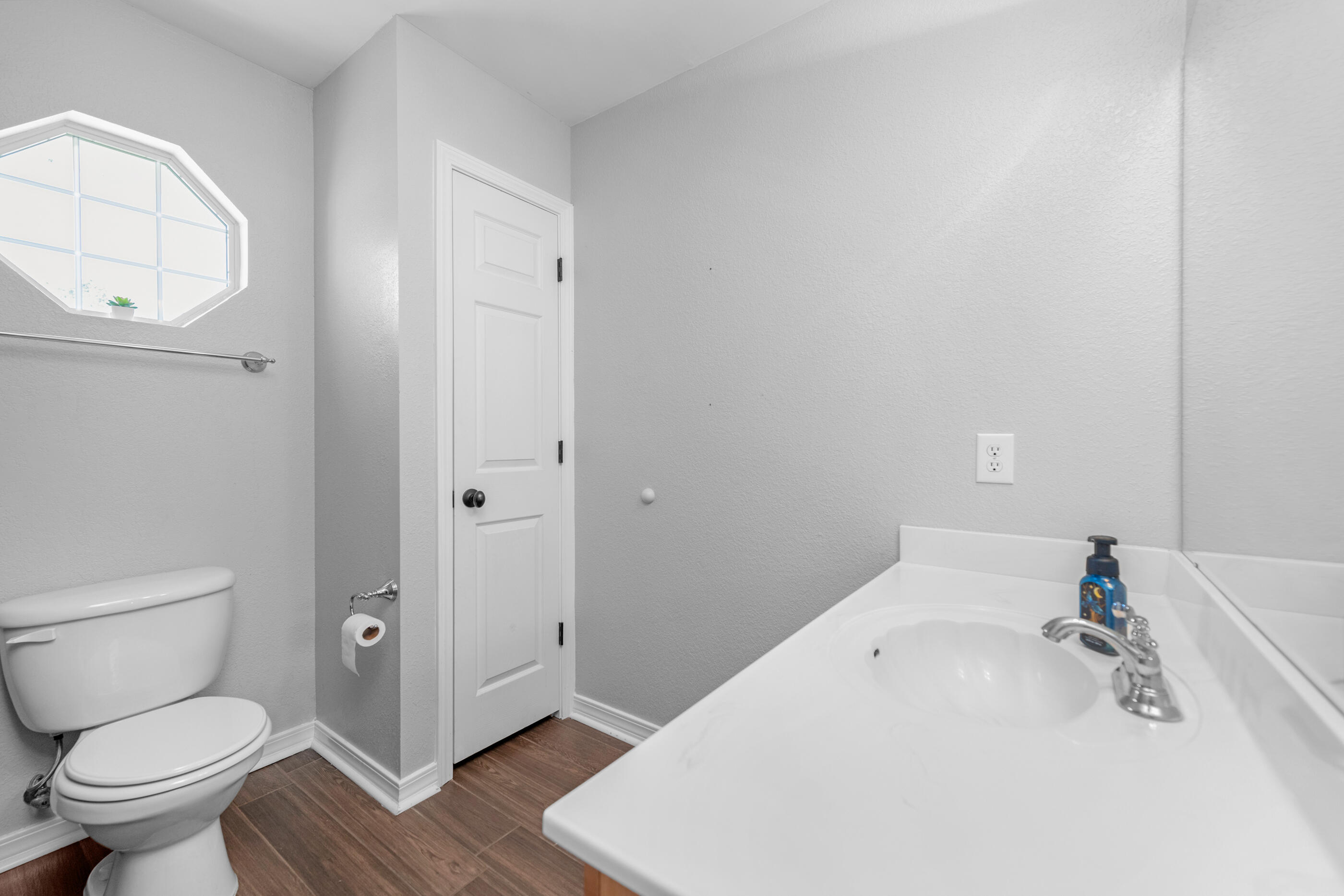6664 Bellingham Street Navarre, FL 32566 - Photo 17 of 28 a bathroom with a sink and a toilet