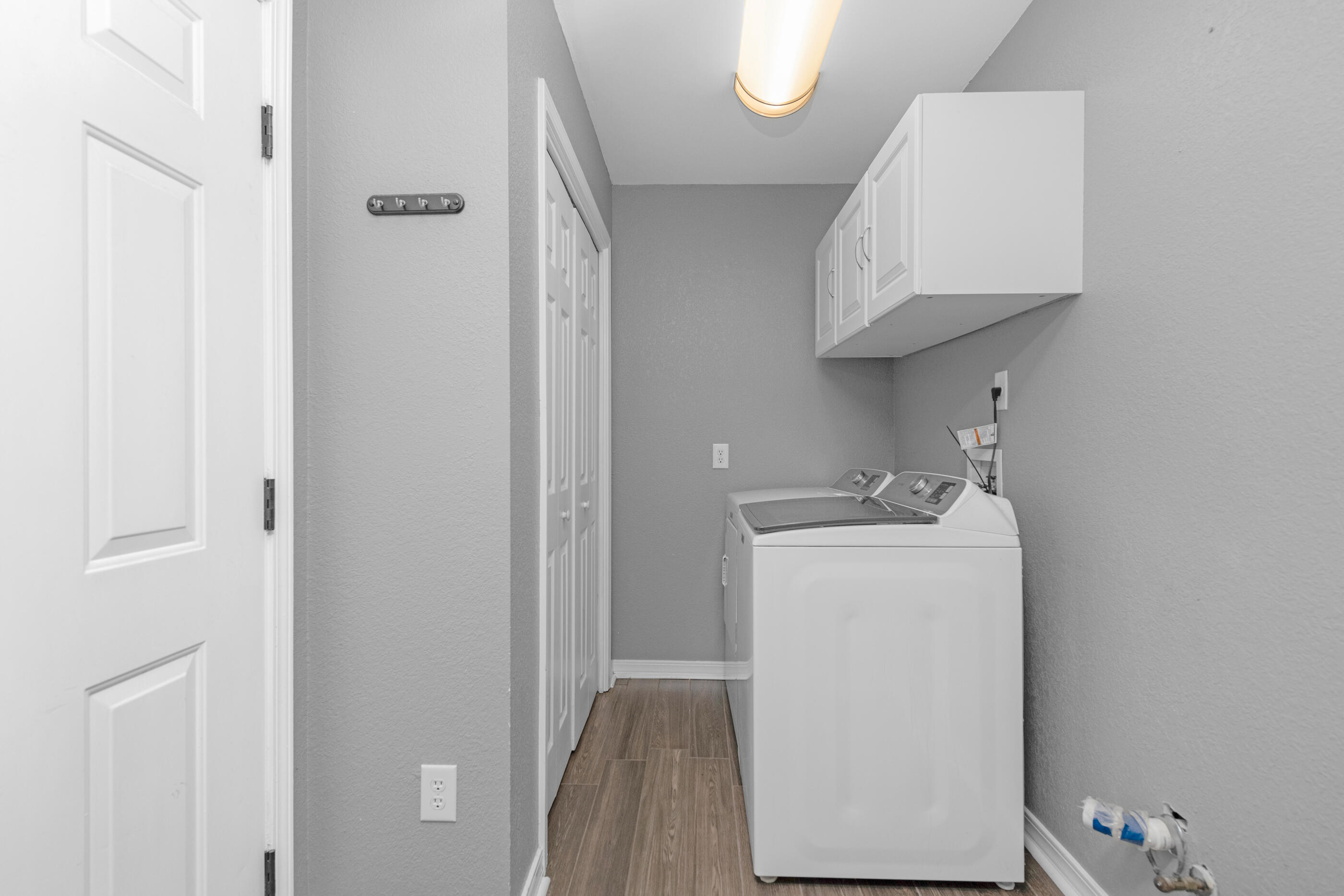 6664 Bellingham Street Navarre, FL 32566 - Photo 22 of 28 a utility room with dryer and washer