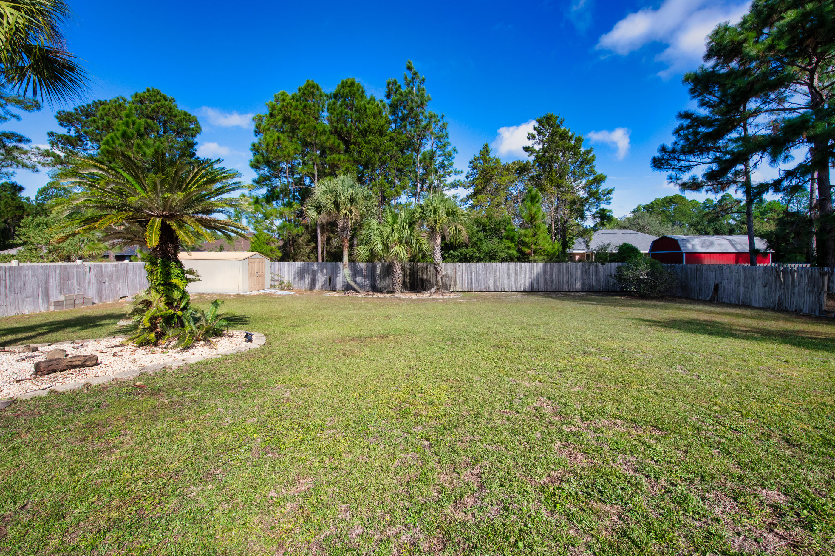 6664 Bellingham Street Navarre, FL 32566 - Photo 23 of 28 a view of a backyard
