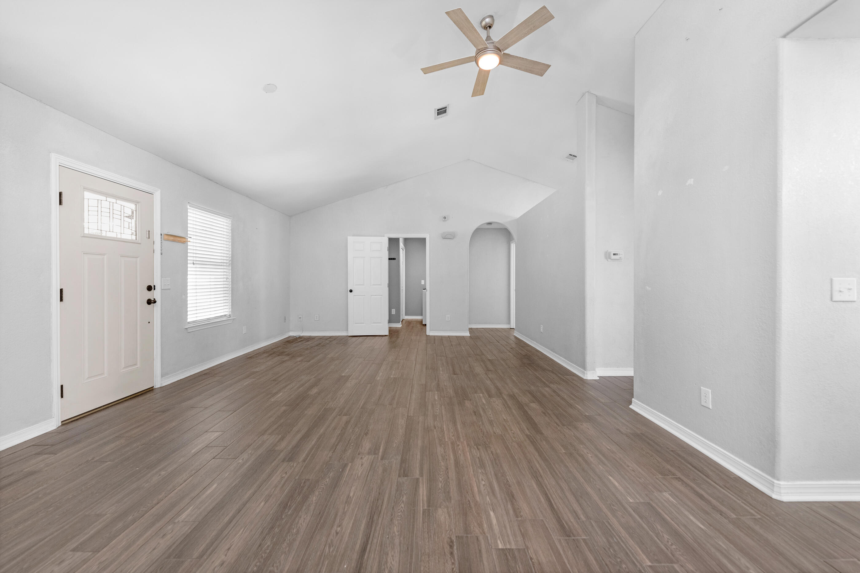 6664 Bellingham Street Navarre, FL 32566 - Photo 5 of 28 a view of empty room with wooden floor