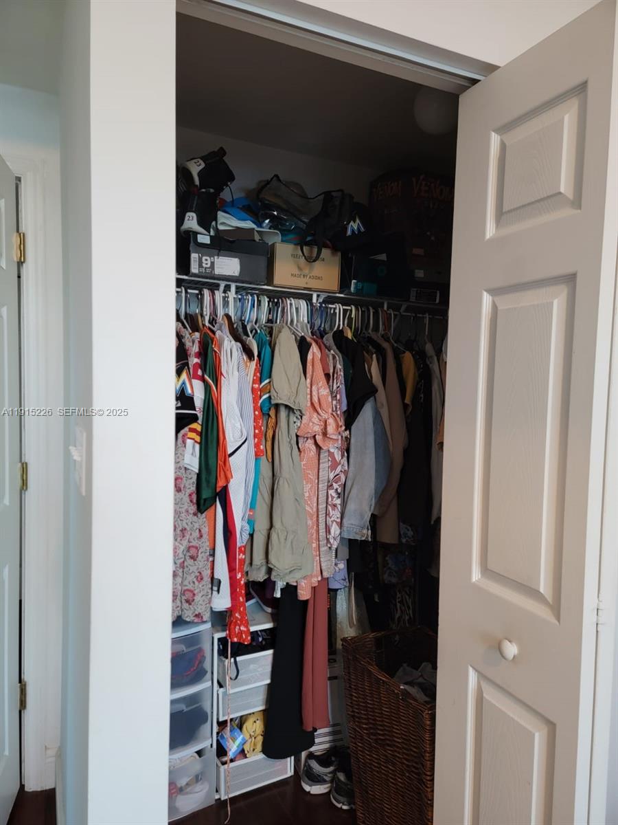 140 South Dixie Highway, Unit 423 Hollywood, FL 33020 - Photo 23 of 32 a view of walk in closet with clothes