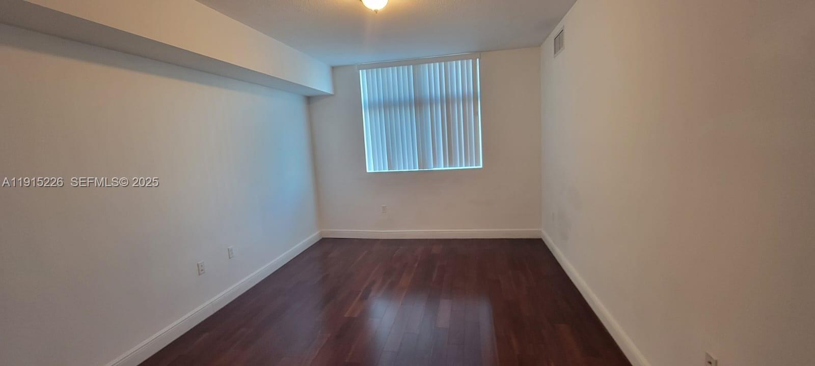 140 South Dixie Highway, Unit 423 Hollywood, FL 33020 - Photo 24 of 32 a view of a small space with wooden floor and a window