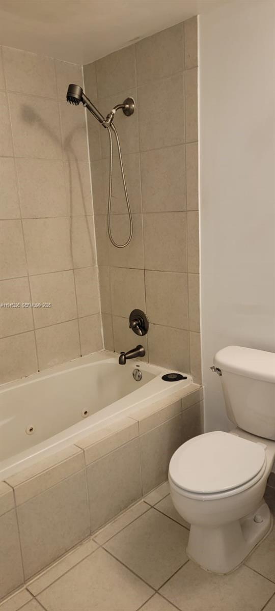 140 South Dixie Highway, Unit 423 Hollywood, FL 33020 - Photo 27 of 32 a white toilet and tub sitting next to a bathroom sink