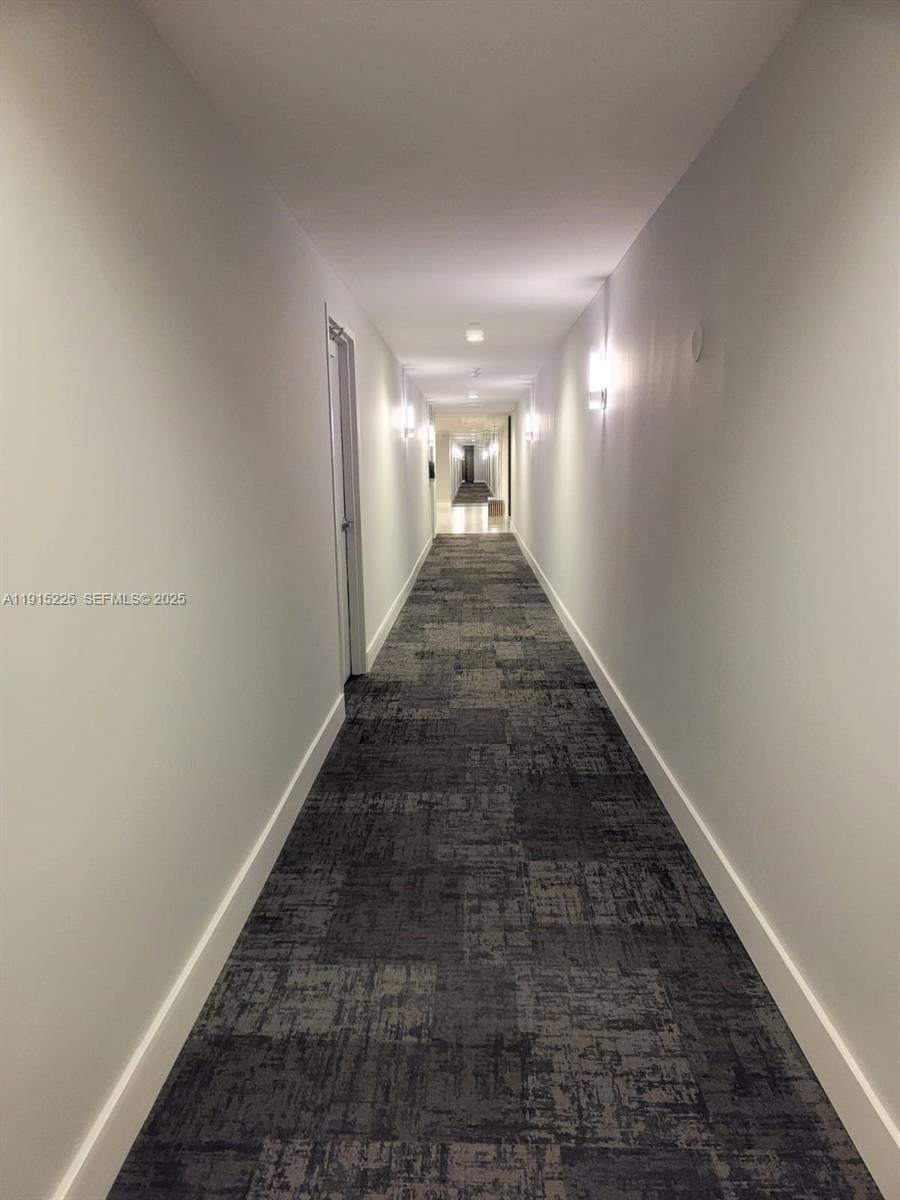 140 South Dixie Highway, Unit 423 Hollywood, FL 33020 - Photo 32 of 32 a view of a hallway to a house