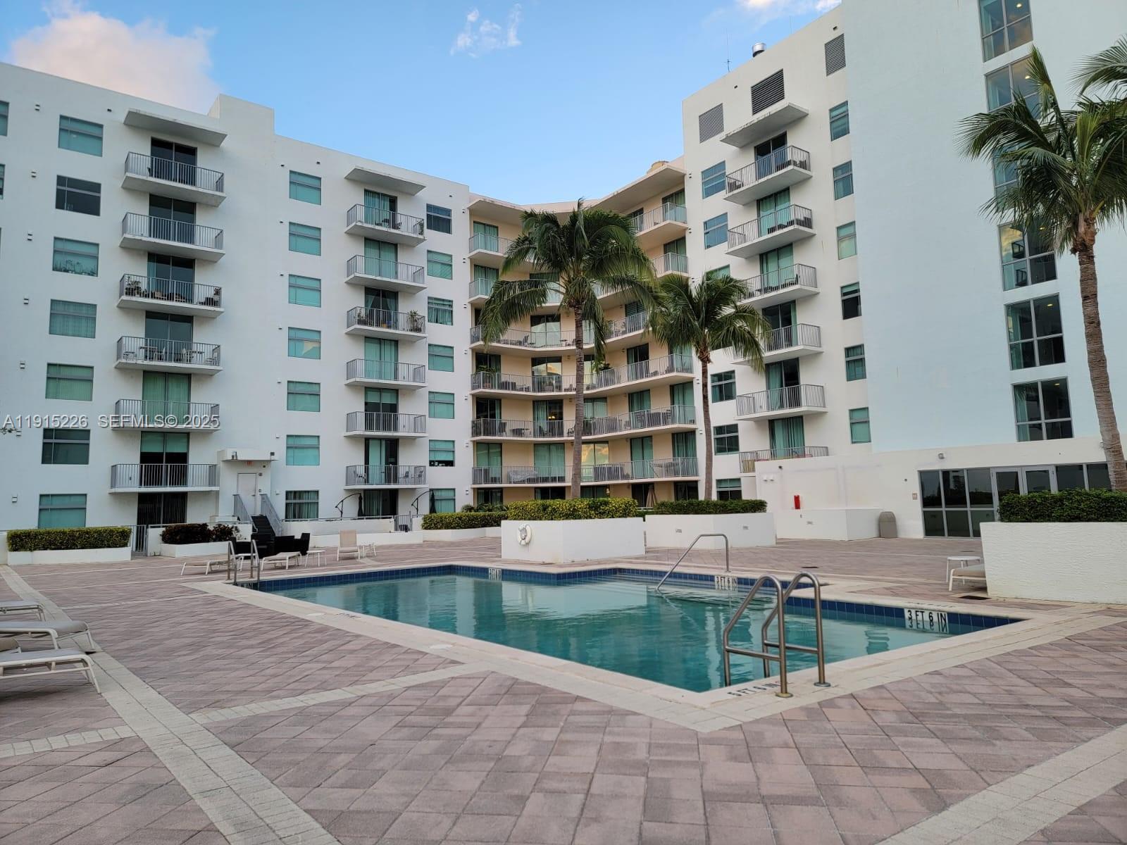140 South Dixie Highway, Unit 423 Hollywood, FL 33020 - Photo 8 of 32 a view of a building with a swimming pool