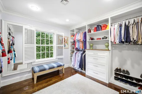 a bedroom with furniture and a window