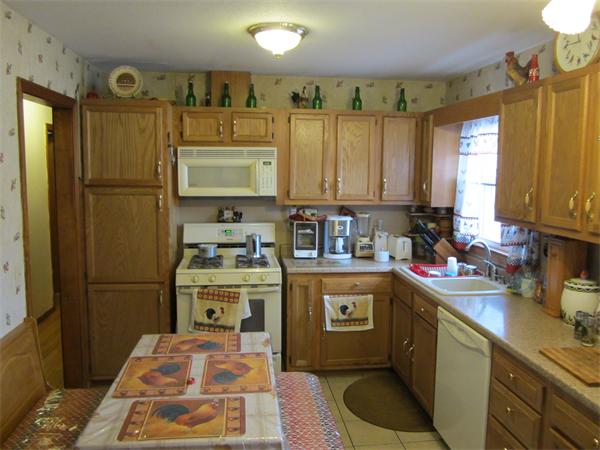 27 Alice Street Springfield, MA 01109 - Photo 4 of 8 a kitchen with a sink stove and refrigerator