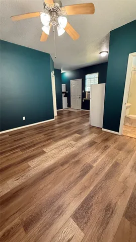 a bathroom with a sink a toilet a mirror and shower