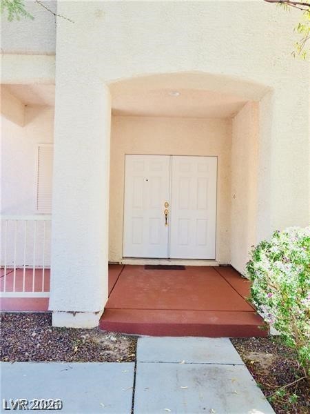 8897 Houston Ridge Avenue Las Vegas, NV 89178 - Photo 3 of 12 A welcoming entry invites you into this property, offering a glimpse of its potential.