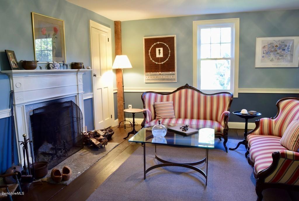 1594 W Road Ashfield, MA 01330 - Photo 14 of 30 a living room with furniture and a fireplace