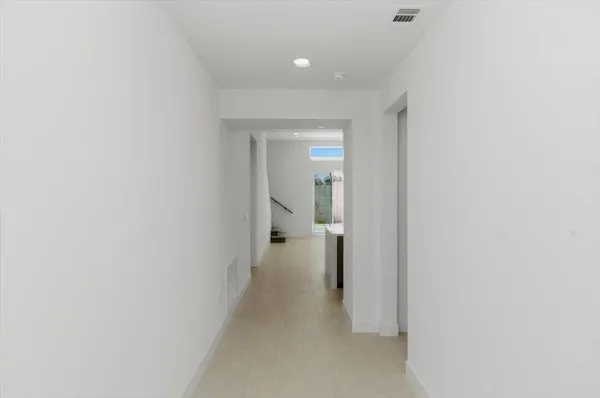 a view of a room with a hallway