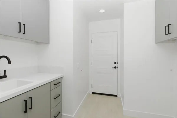 a view of bathroom with two sink and a mirror