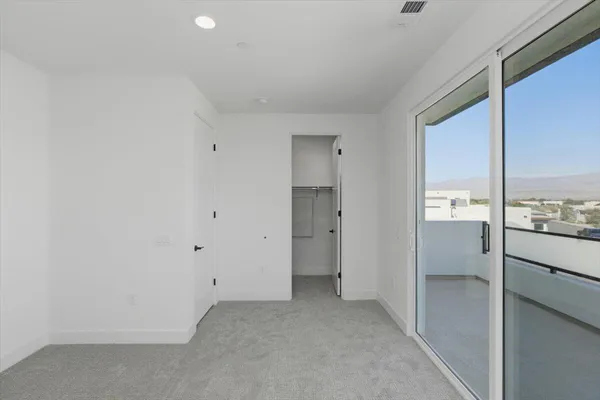 a view of a kitchen cabinets and a window
