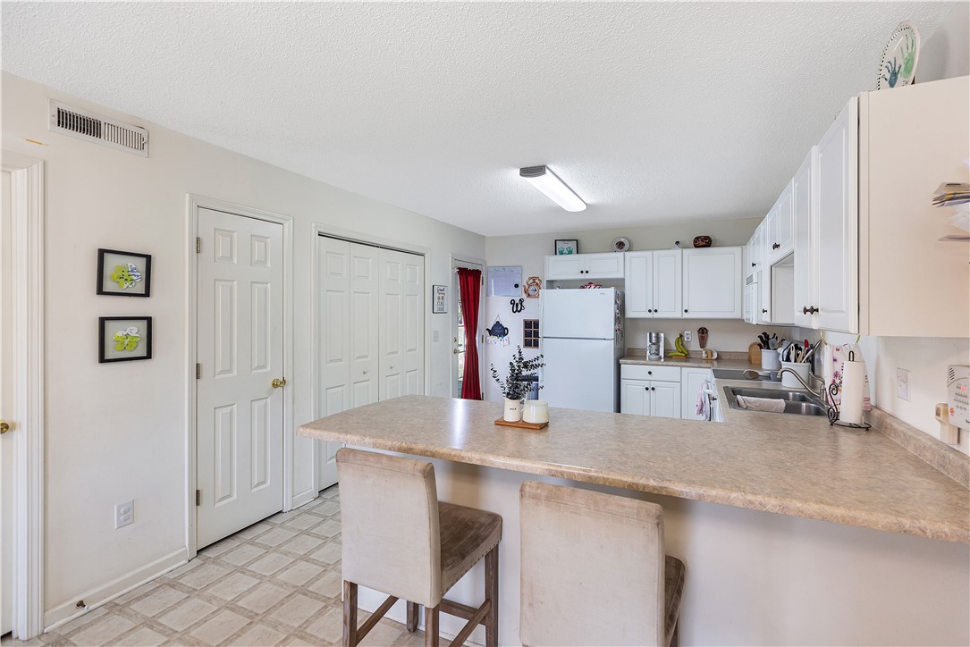 108 Grindstone Way Anderson, SC 29625 - Photo 12 of 30 This bright kitchen features ample counter space and a convenient breakfast bar, perfect for casual dining.