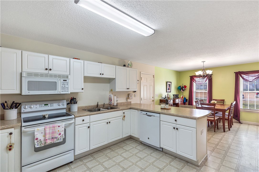 108 Grindstone Way Anderson, SC 29625 - Photo 14 of 30 This spacious kitchen and dining area offers functional design for everyday living.