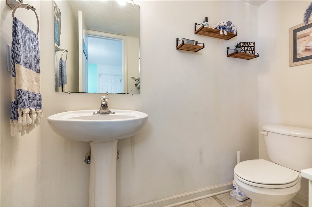 108 Grindstone Way Anderson, SC 29625 - Photo 16 of 30 This bright bathroom features a pedestal sink and practical shelving for daily essentials.