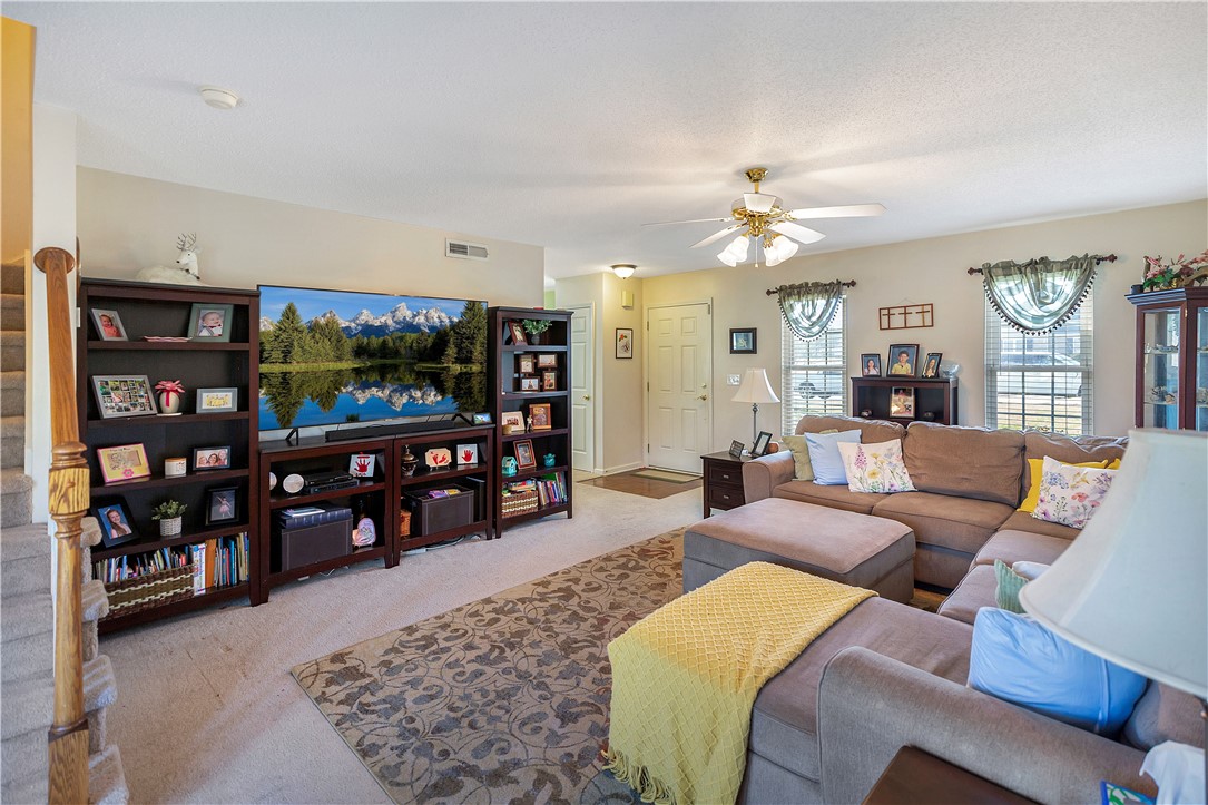 108 Grindstone Way Anderson, SC 29625 - Photo 19 of 30 This inviting living room features warm neutral tones and ample natural light, creating a comfortable ambiance.