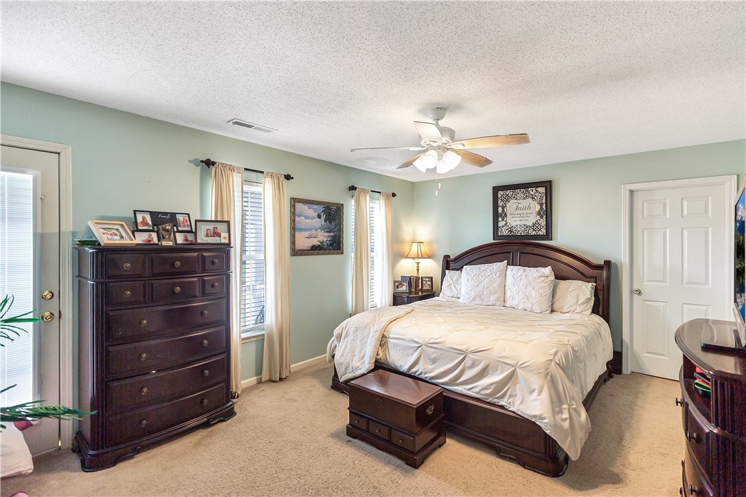108 Grindstone Way Anderson, SC 29625 - Photo 22 of 30 This tranquil primary bedroom offers comfort and a connection to the outdoors through its bright windows.
