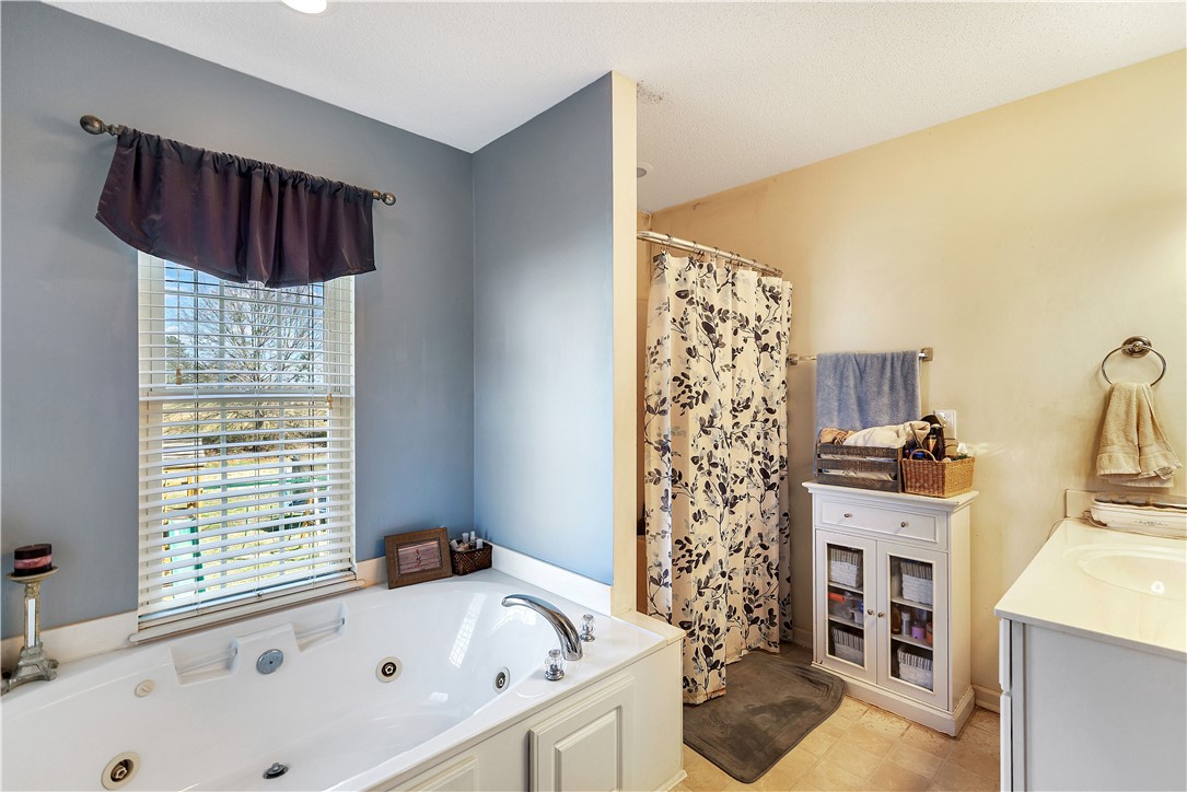 108 Grindstone Way Anderson, SC 29625 - Photo 23 of 30 Relax in the deep soaking tub in this serene bathroom.
