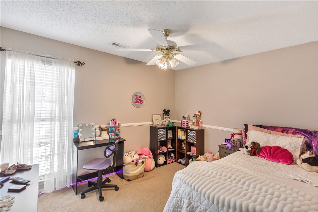 108 Grindstone Way Anderson, SC 29625 - Photo 28 of 30 This cozy bedroom features warm tones, a large window, and practical storage solutions.