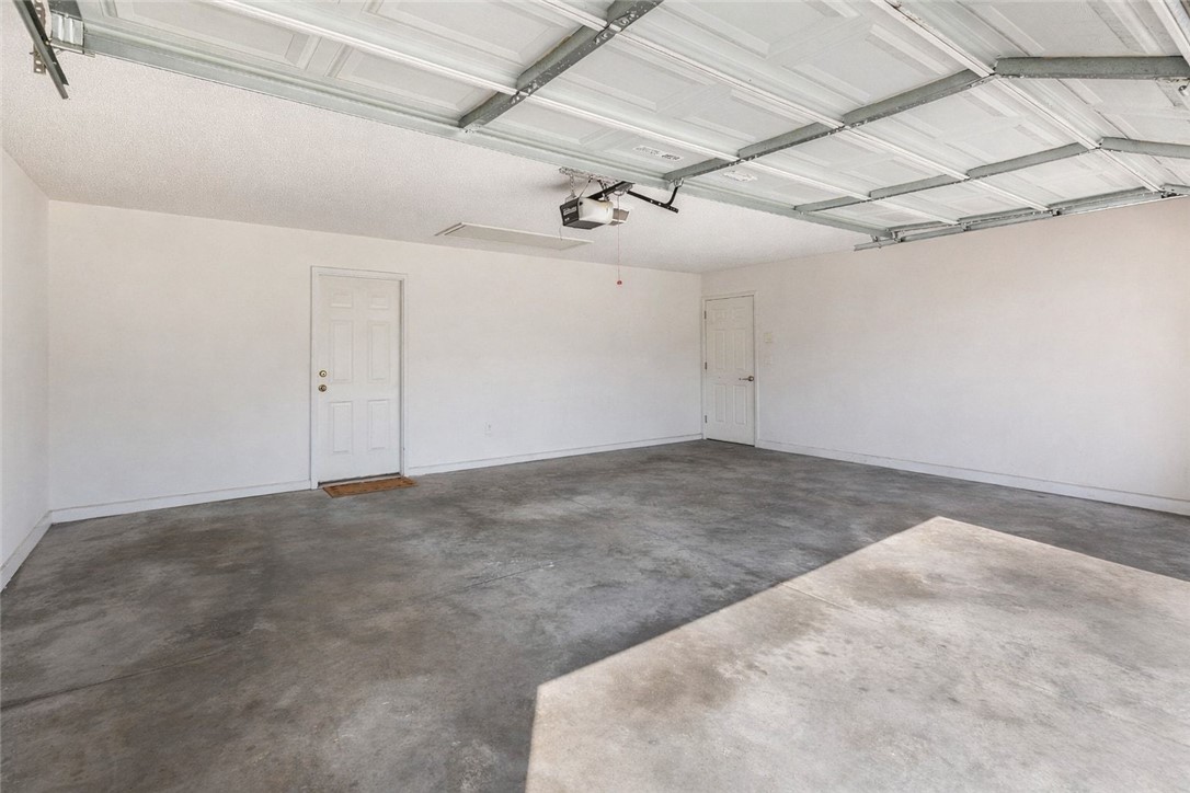 108 Grindstone Way Anderson, SC 29625 - Photo 29 of 30 This spacious garage offers ample room for vehicles and storage with a durable concrete floor.