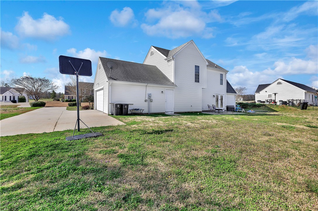 108 Grindstone Way Anderson, SC 29625 - Photo 5 of 30 This residence features a spacious yard and an attached garage with a wide concrete driveway.