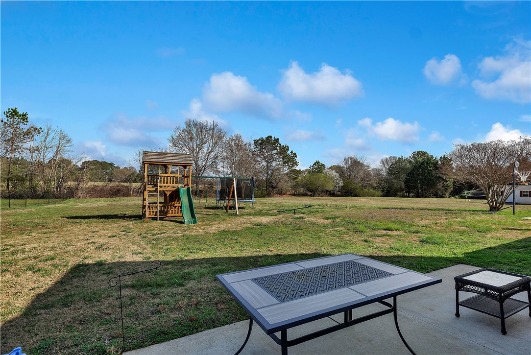 108 Grindstone Way Anderson, SC 29625 - Photo 8 of 30 This expansive yard offers ample space for recreation and outdoor enjoyment.