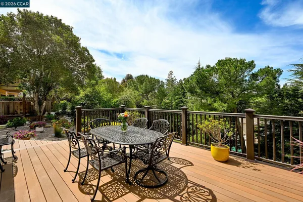 a view of a balcony with furniture