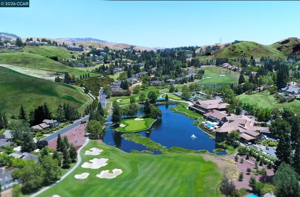 a front view of a building with tree s