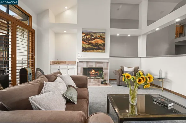 a living room with furniture flowerpot and window